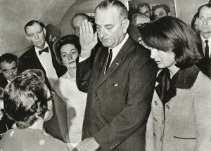 LBJ swears in aboard Air Force One in Dallas, TX following the assasination of John F. Kennedy on 22 November, 1963. Visible on Johnson's left lapel is the Silver Star, which he wore prominently throughout his career as a politician.